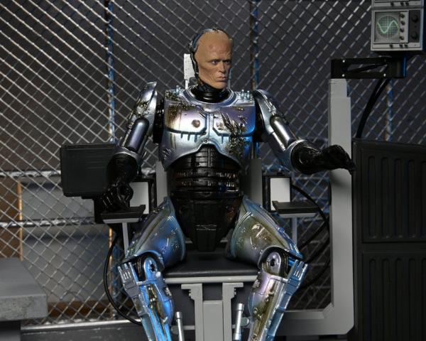 RoboCop: Battle Damaged RoboCop with Chair 18 cm Action Figure Ultimate - Neca